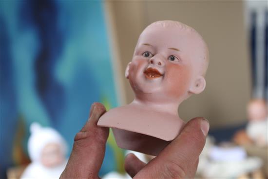 A Heubach character doll, intaglio eyes on shoulder plate broken, 18in., a Heubach character baby, intaglio eyes, hard body, 9in. and a